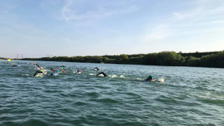 Open water swimmers in the lake at Action Watersports