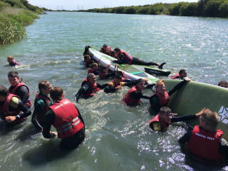 Group Paddleboarding Action Watersports
